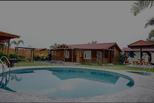 Chevella House | Arunam - A Royal Wooden Cottage & Pool Farmhouse
