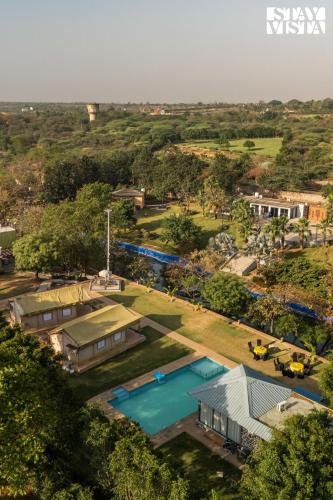 Gurugram Villa | StayVista at Kaimalgarh Aravalli Estate with Pool, Lake & views of Aravalli Hills