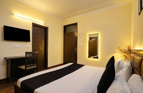 Sainik Farm Hotel | A Square Homes & Stay