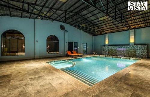 Varanasi Villa | Arcadian Manor with Indoor Pool Indoor-Outdoor Games at Varanasi by StayVista