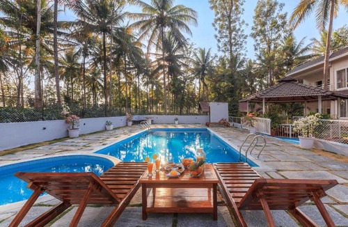 Kushalnagar Villa | Bask In The Greens by StayVista - 4BHK Pet-Friendly Villa with Home Theatre