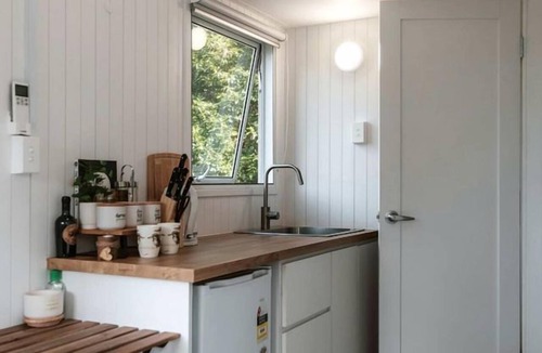 Palmwoods Cabin | Charming Tiny House Rental for Glamping in Queensland