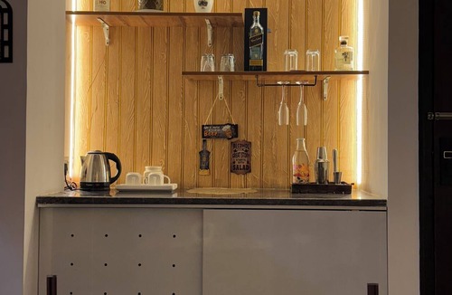 Gurugram Apartment | The Stranger's Stay | 1 BHK | Near Medanta | WiFi | Bar & Coffee Corner