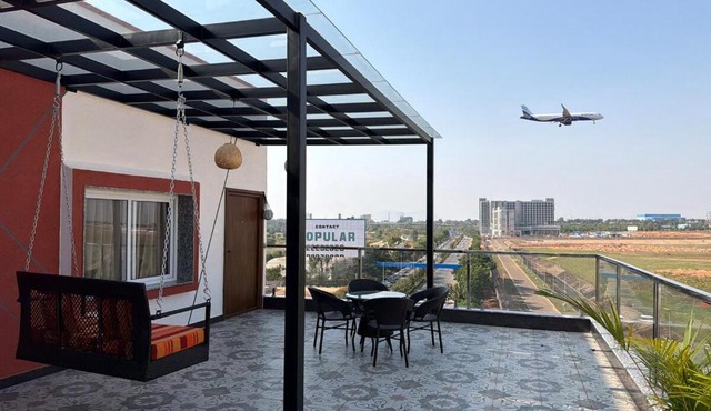 Runway Retreat Rooftop Swing, Airport View
