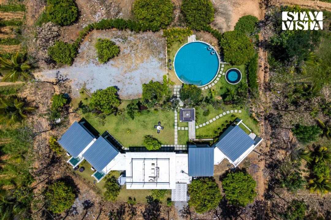 Nagamangala Villa | StayVista at SIHAYA with bathtub, mountain view & AC