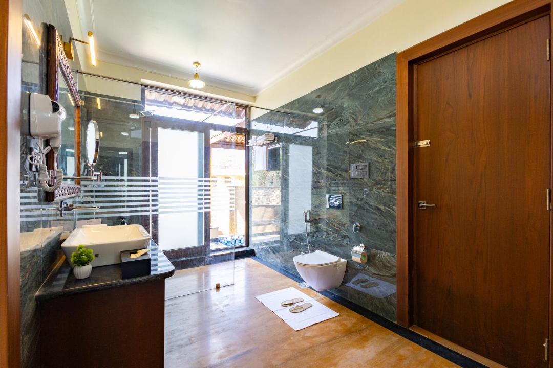 Jamool Khera Apartment | ELIVAAS Signature Tiger Cave Suite with Pvt and Shared Pool On Main Ranthambore Rd