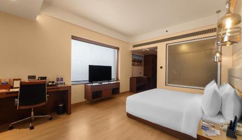 Deluxe Room - INR 500 Hotel Credit redeemable on Food & Soft Bev (min spend of Inr 1000 - Applicable one during stay), Enjoy Happy Hours with 1+1 offer, 20% off on One-way Airport/Railway/Bus Transfer