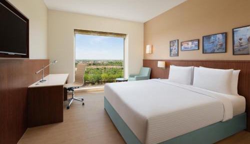 Twin Room: (15% Discount on food & soft beverage at Kava Restaurant, Happy Hours (Buy 1 Get 1) on IMFL beverages at the BAR)