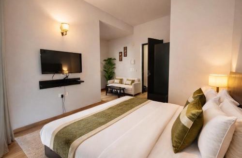 Vrindavan Hotel | The Garnet Apartment With Balcony # Lift # Garden # Ac rooms # Private Parking # Near Prem Mandir # Located Inside- Omaxe Eternity Vrindavan #