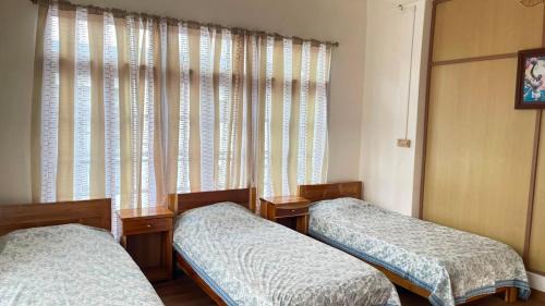 Aizawl House | Casa Zo The Trio room with three single beds & balcony