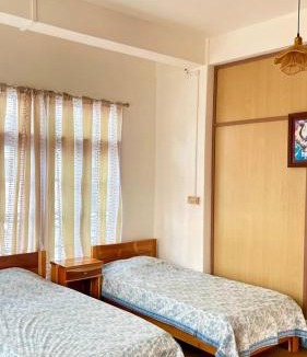 Aizawl House | Casa Zo The Trio room with three single beds & balcony