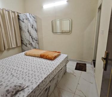 Chikkamagaluru Apartment | Kalpavrukksha Luxury Service Apartment Unit 3- Lavish Hall, Smart TV, 2 Bedroom attached washroom fully functional kitchen and Utilities and A balcony with great landmark view