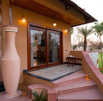 Jamool Khera Apartment | ELIVAAS Signature Tiger Cave Suite with Pvt and Shared Pool On Main Ranthambore Rd