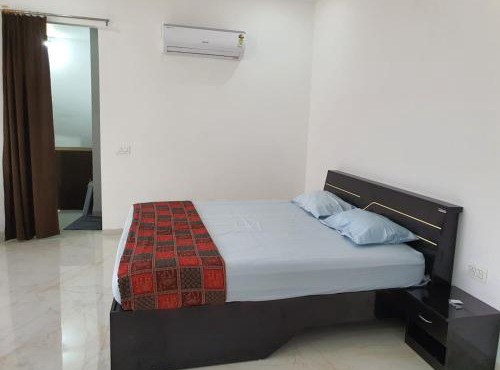Spacious bedroom with a patio attached