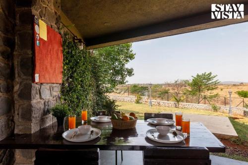 Stone House Bezze by StayVista with Lake view, Jacuzzi & Lawn - your perfect getaway in Nashik